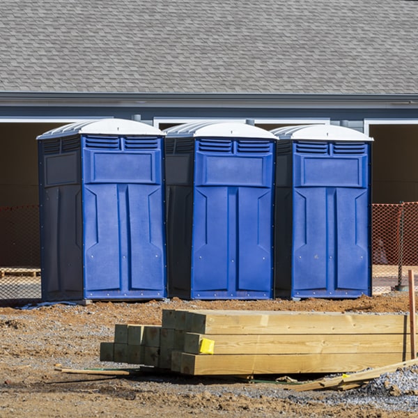 what is the cost difference between standard and deluxe portable restroom rentals in Muse